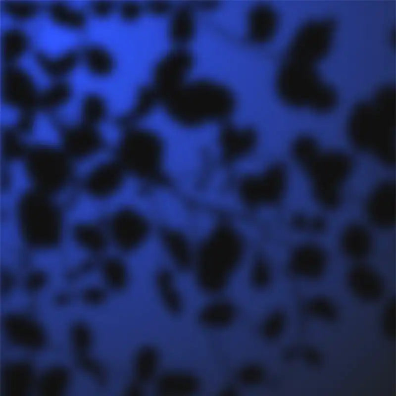 Abstract pattern of black spots against a deep blue background.